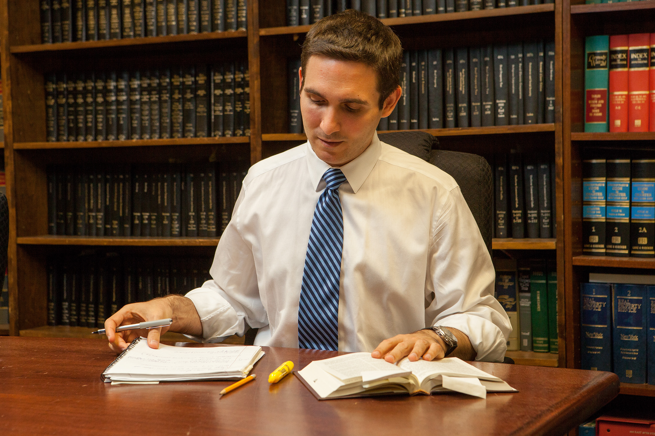 Ben Kallos in a law library